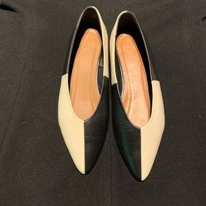 Black and beige leather ballerina style of shoes